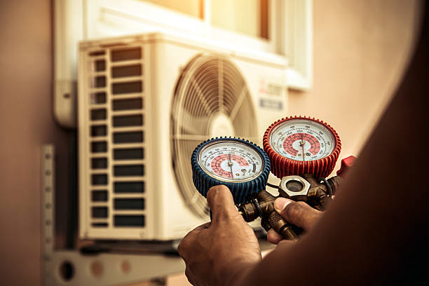 Professional Heat Pump Repair technician working in Hines, OR